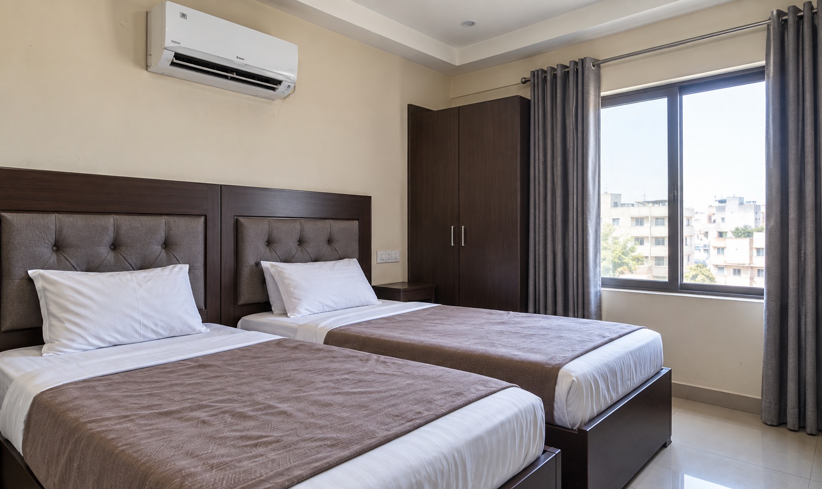 Illustrative two-bed room with practical furnishings